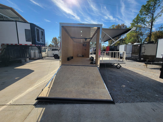 8.5' X 24' Cobalt Blue Stage & Event Marketing Concession Trailer Rear View with Stage Down and Ramp Out