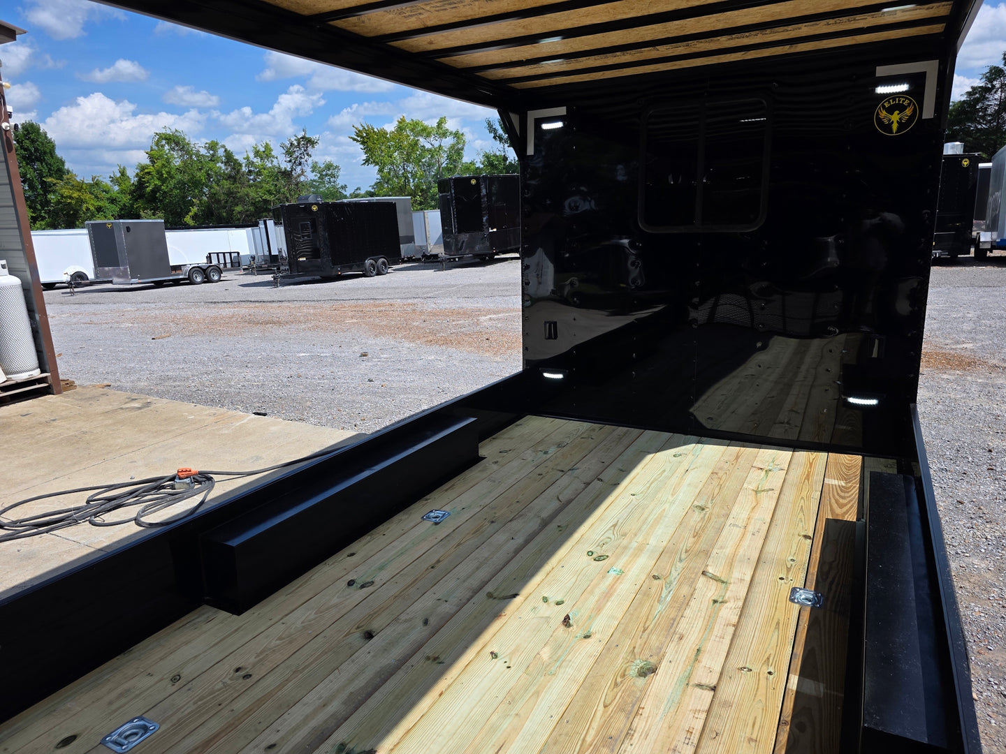 8.5' X 24' Custom Black Hybrid Enclosed Trailer (2) 5,200 lb Axles Porch back right angle picture 