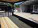 8.5' X 24' Custom Black Hybrid Enclosed Trailer (2) 5,200 lb Axles porch front left angle picture 