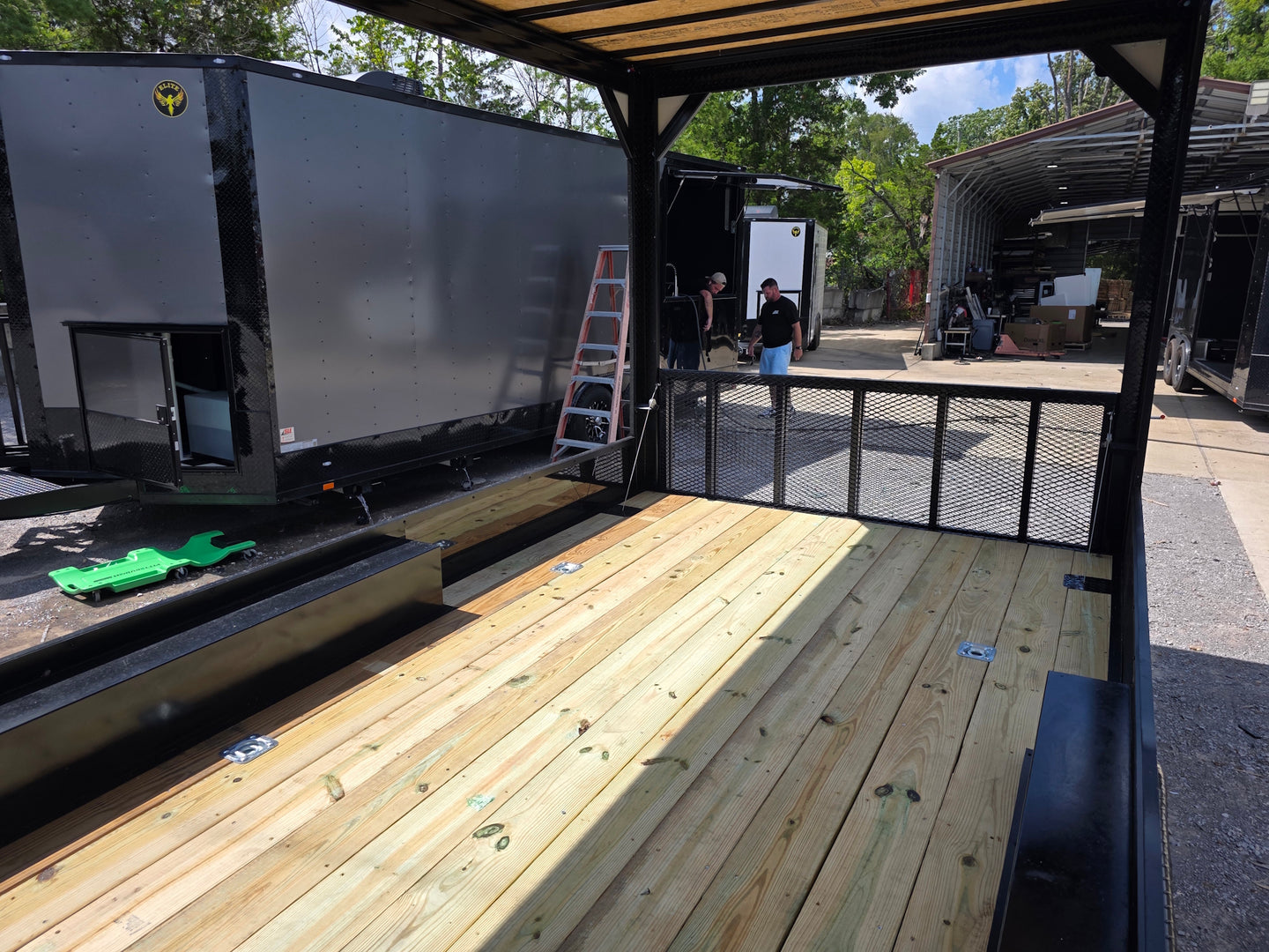 8.5' X 24' Custom Black Hybrid Enclosed Trailer (2) 5,200 lb Axles Porch front right angle picture 