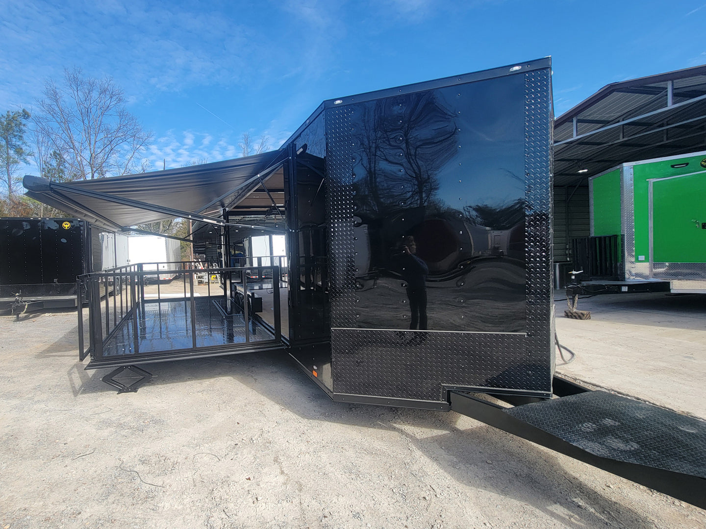 8.5' X 24' Custom Enclosed Stage Trailer Mobile Cigar Lounge Passenger Side Front With Awning Extended and Stage Out 