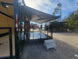 8.5' X 24' Custom Enclosed Stage Trailer Mobile Cigar Lounge Passenger Side Rear Awning Side Shot 