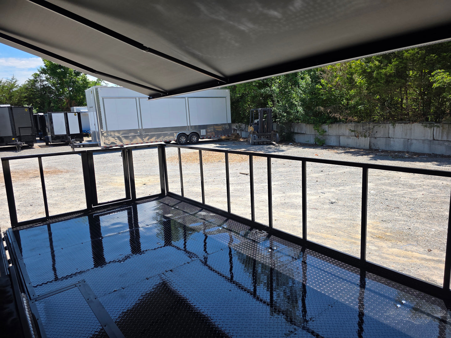 8.5' X 24' Custom Stage and Marketing Showcase Enclosed Trailer Interior back side picture  Interior stage back left angle view 