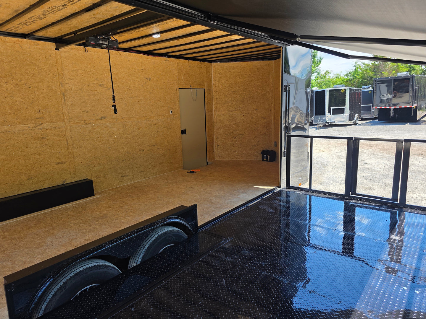 8.5' X 24' Custom Stage and Marketing Showcase Enclosed Trailer Interior back side picture  Interior stage back right angle picture 
