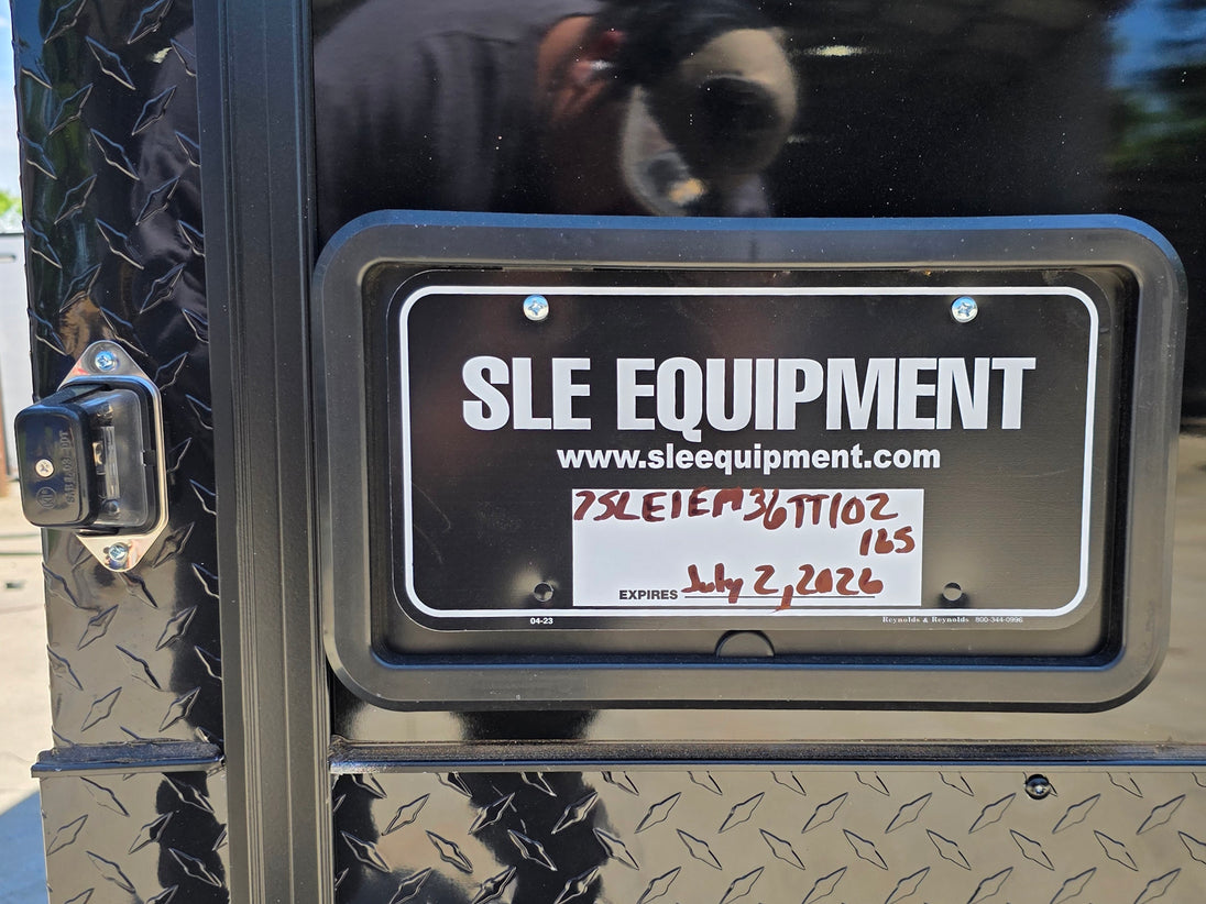 8.5' X 24' Custom Stage and Marketing Showcase Enclosed Trailer Interior back side picture License plate bracket picture 
