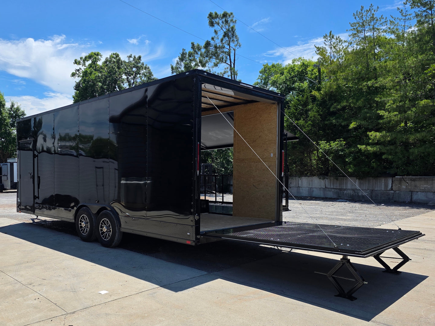 8.5' X 24' Custom Stage and Marketing Showcase Enclosed Trailer Open back left angle picture 