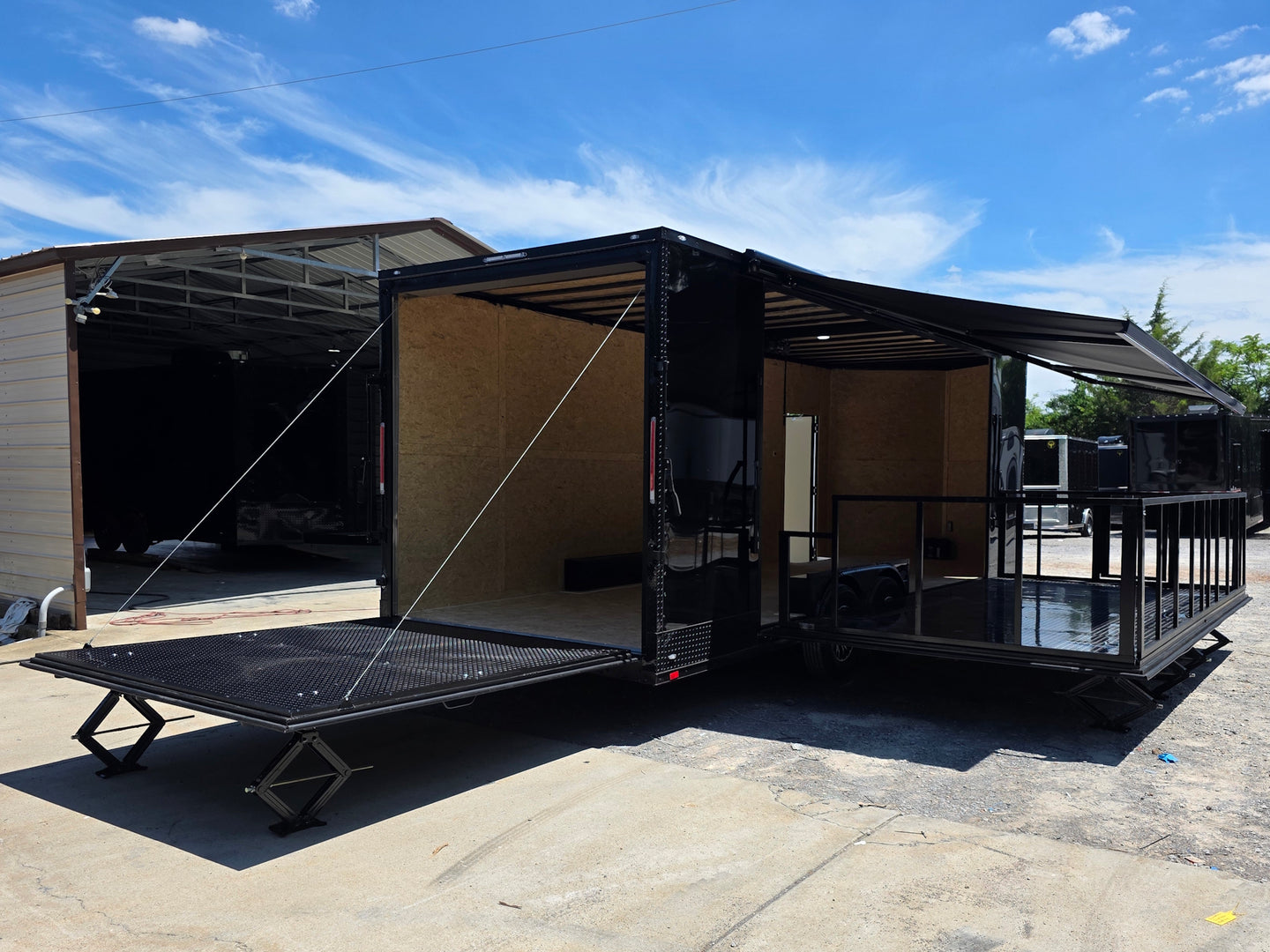 8.5' X 24' Custom Stage and Marketing Showcase Enclosed Trailer Open back right angle picture 