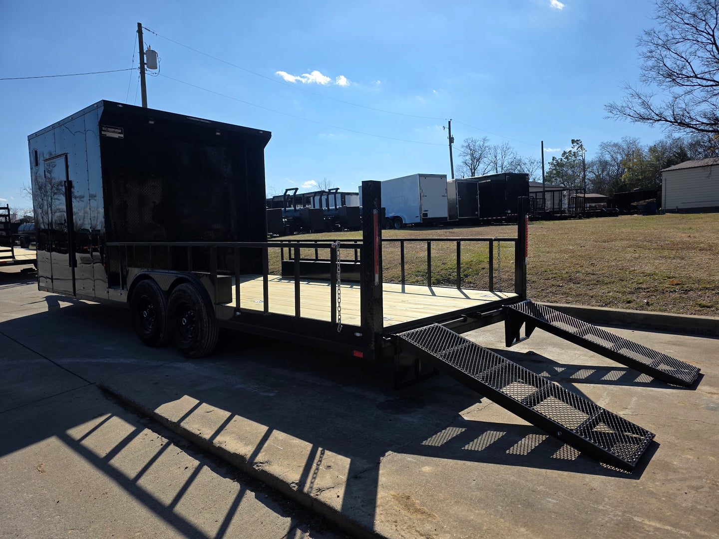 8.5' X 24' Hybrid Trailer Black With Black Out Package 7K Axles back left angled view picture with ramp down 