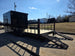 8.5' X 24' Hybrid Trailer Black With Black Out Package 7K Axles back left angled view picture with ramp down 