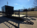 8.5' X 24' Hybrid Trailer Black With Black Out Package 7K Axles back left angled view picture with ramp down 