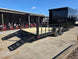 8.5' X 24' Hybrid Trailer Black With Black Out Package 7K Axles back right angled view picture with ramp down 