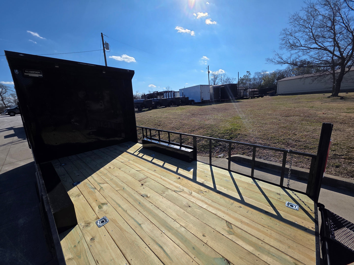8.5' X 24' Hybrid Trailer Black With Black Out Package 7K Axles front deck left angled view picture 