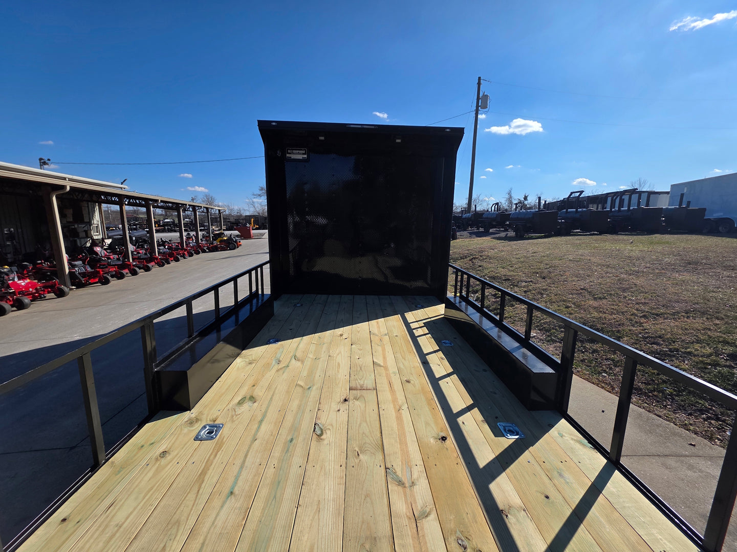 8.5' X 24' Hybrid Trailer Black With Black Out Package 7K Axles front deck angled view picture 