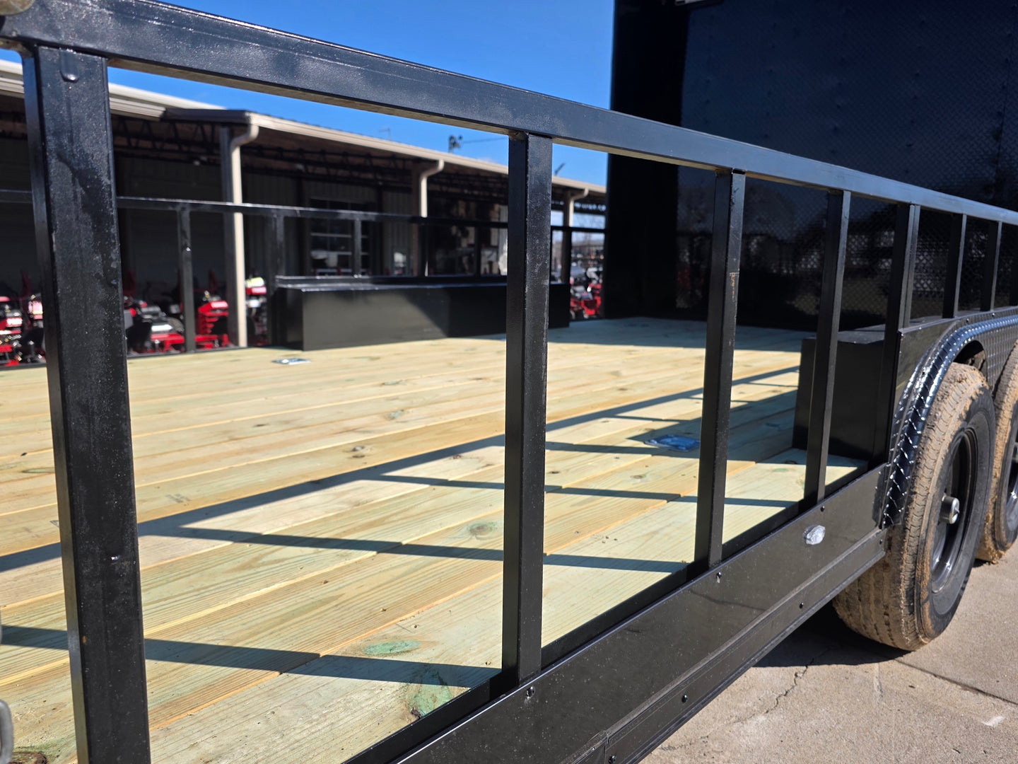 8.5' X 24' Hybrid Trailer Black With Black Out Package 7K Axles side railing view picture 