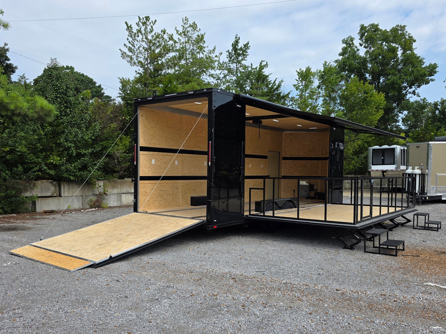 8.5' X 26' Black Custom Marketing and Event Trailer With 16' Stage Open back right angle picture 