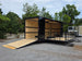 8.5' X 26' Black Custom Marketing and Event Trailer With 16' Stage Open back right angle picture 