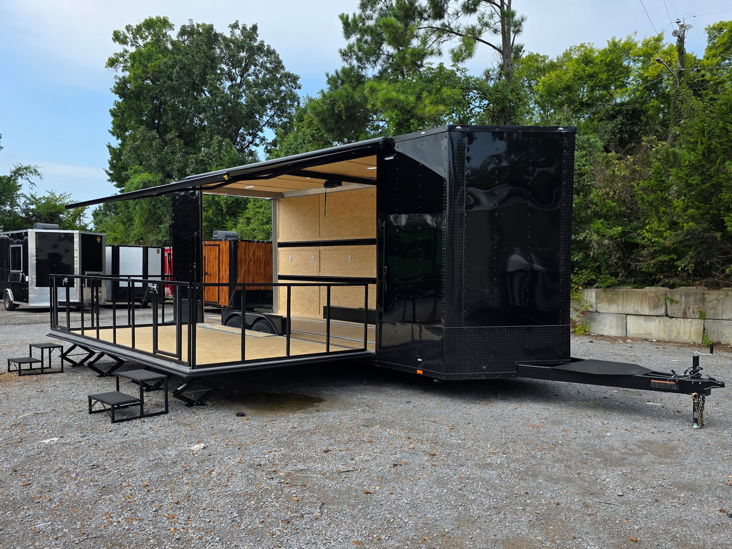 8.5' X 26' Black Custom Marketing and Event Trailer With 16' Stage Open front left angle picture 