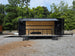 8.5' X 26' Black Custom Marketing and Event Trailer With 16' Stage Open left side picture 