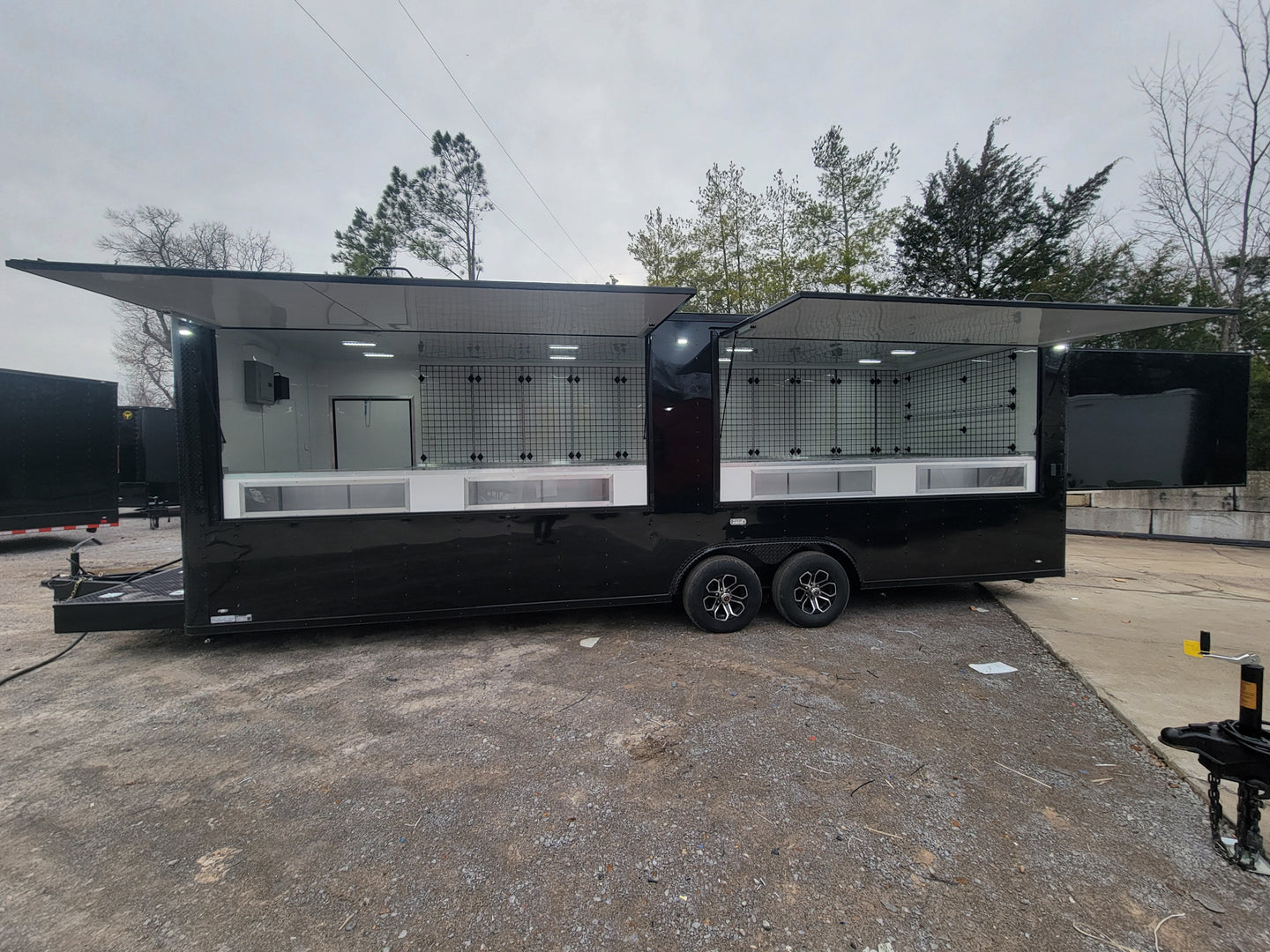 8.5_X_26_Custom_Enclosed_Merchandise_and_Marketing_Trailer_with_Black_Out_Trim, Specific View. 