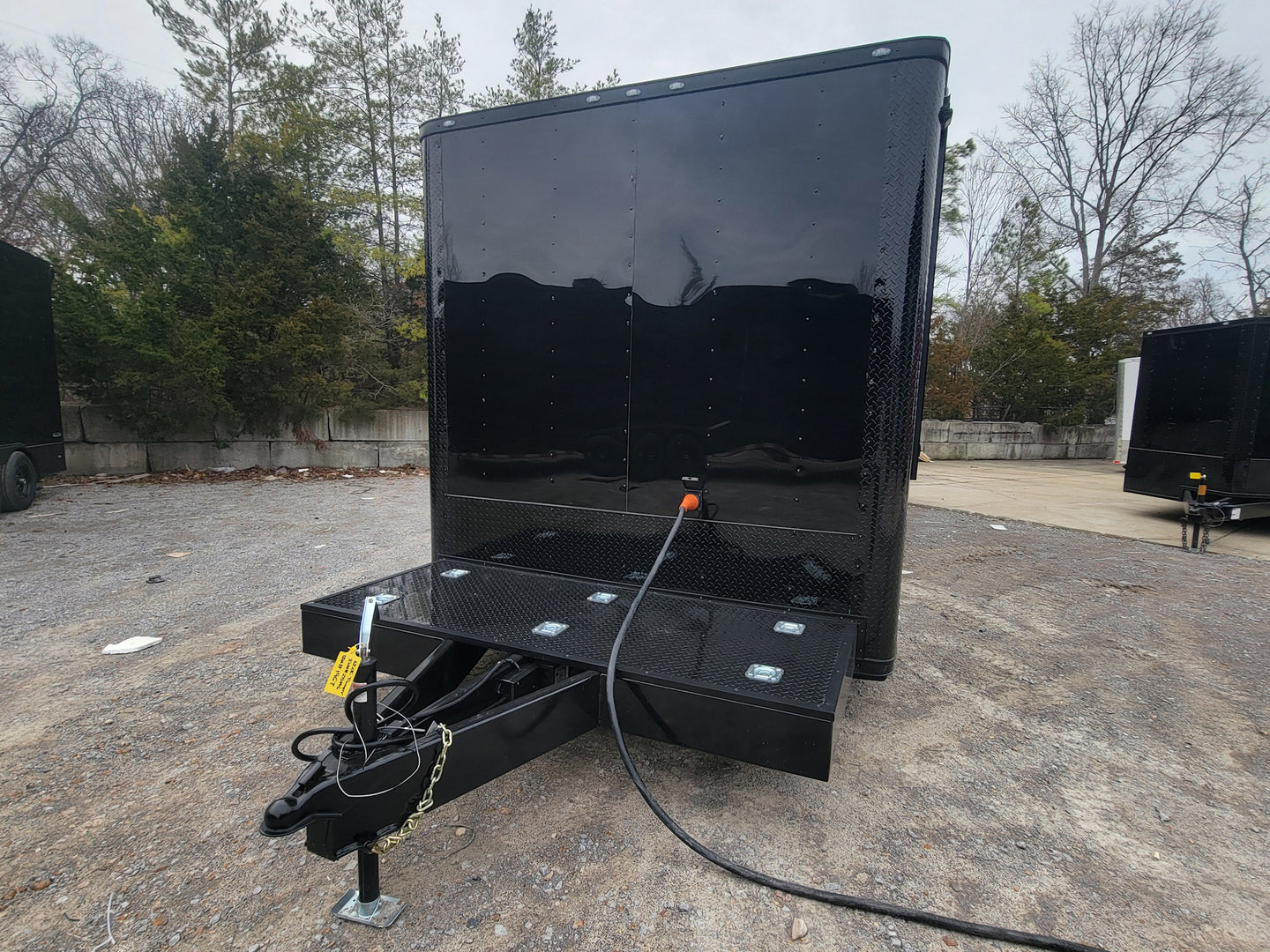 8.5' X 26' Custom Enclosed Merchandise and Marketing Trailer with Black Out Trim, Side View. 