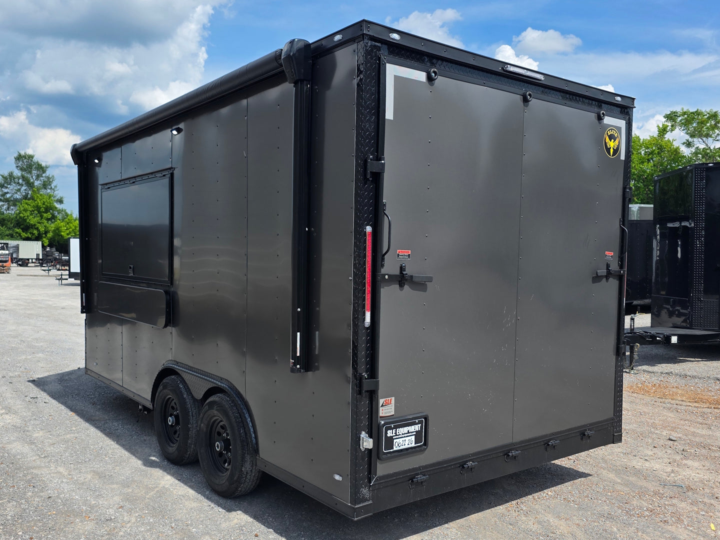 8.5'x16' Charcoal W/ Black Out Trim V-Nose Dual Awning Concession Trailer Back left angle picture 