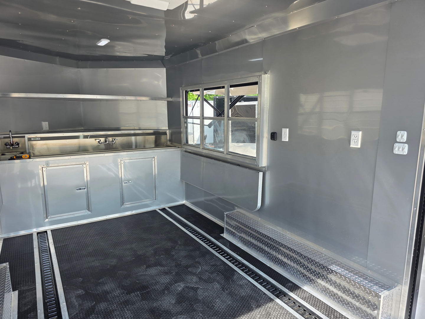 8.5'x16' Charcoal W/ Black Out Trim V-Nose Dual Awning Concession Trailer Interior back left angle picture 