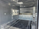 8.5'x16' Charcoal W/ Black Out Trim V-Nose Dual Awning Concession Trailer Interior back right-angle picture 