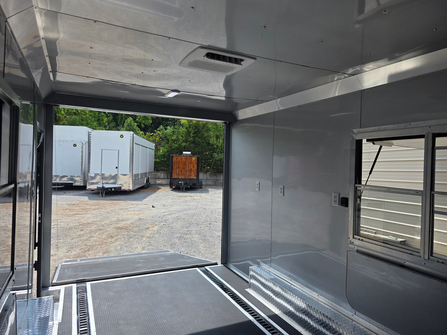 8.5'x16' Charcoal W/ Black Out Trim V-Nose Dual Awning Concession Trailer Interior front left angle picture 
