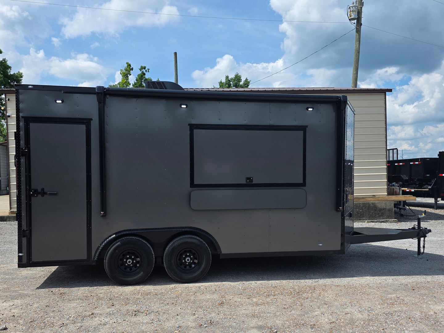 8.5'x16' Charcoal W/ Black Out Trim V-Nose Dual Awning Concession Trailer Left side picture 