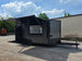 8.5'x16' Charcoal W/ Black Out Trim V-Nose Dual Awning Concession Trailer Open front left angle picture 