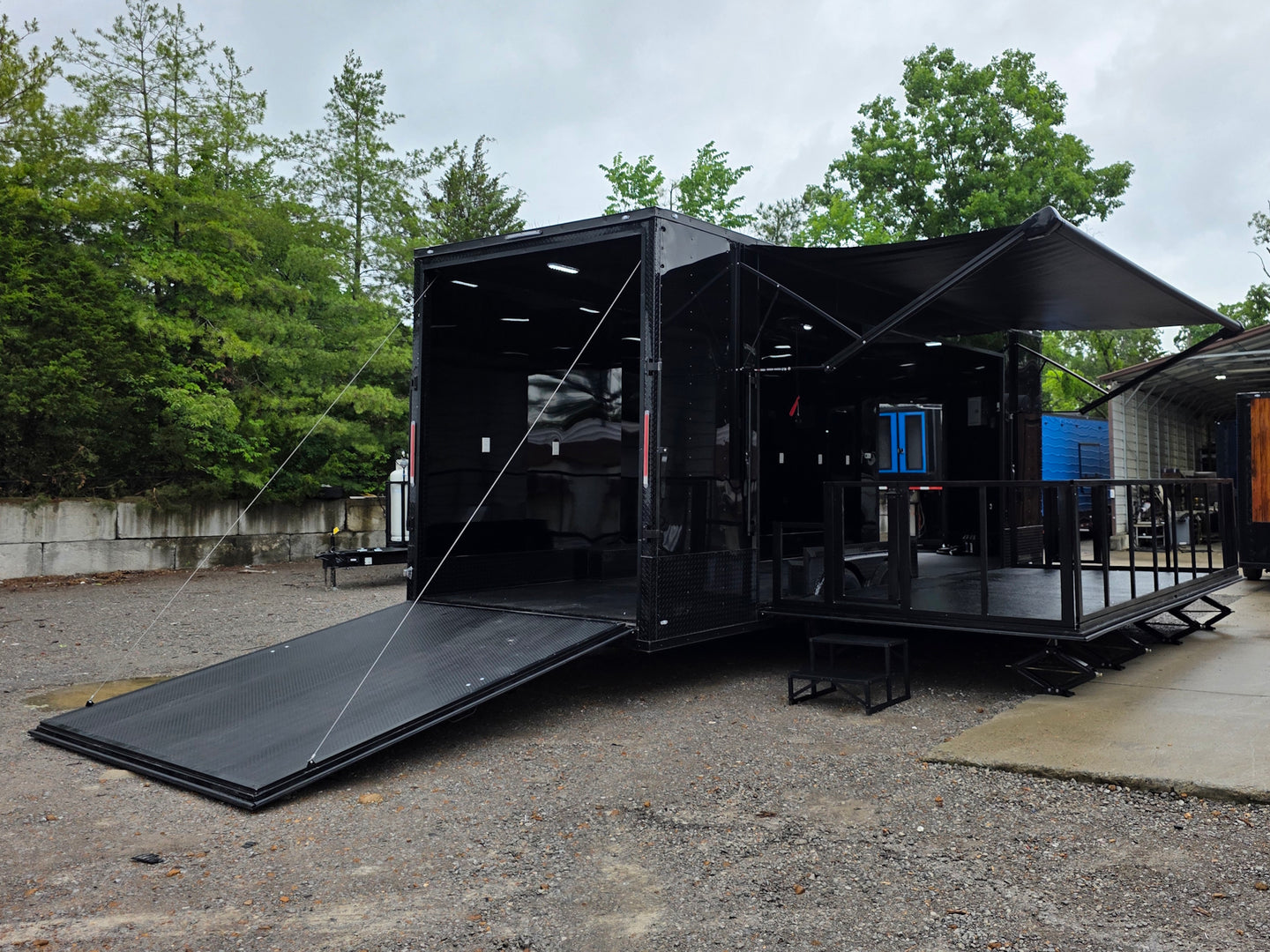 8.5'x24' Black Custom Event Stage Trailer w/ 16' Fold-Down Stage Open back right angle picture 