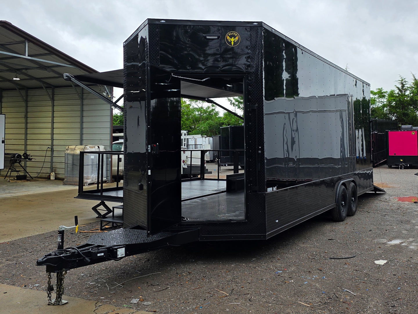 8.5'x24' Black Custom Event Stage Trailer w/ 16' Fold-Down Stage Open front right-angle picture 