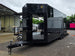8.5'x24' Black Custom Event Stage Trailer w/ 16' Fold-Down Stage Open front right-angle picture 