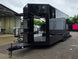 8.5'x24' Black Custom Event Stage Trailer w/ 16' Fold-Down Stage Open front right-angle picture 