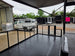 8.5'x24' Black Custom Event Stage Trailer w/ 16' Fold-Down Stage Stage front right angle picture 