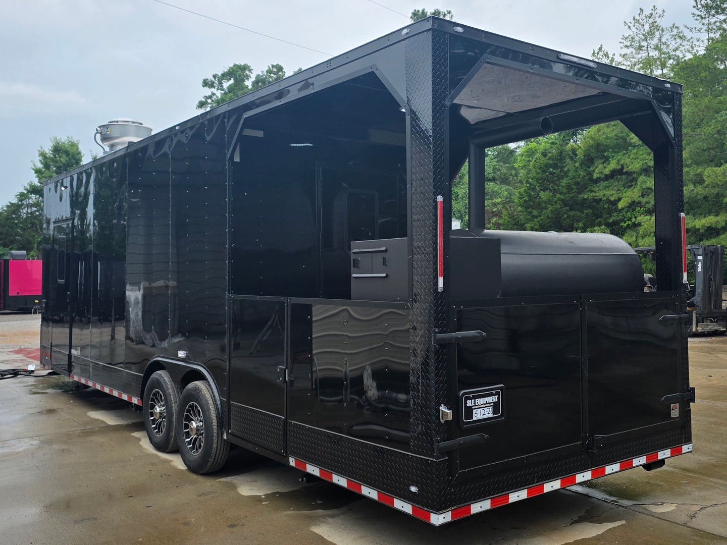 8.5'x28' Black w/ Black out trim Concession Trailer with Porch Package Back left angle picture 