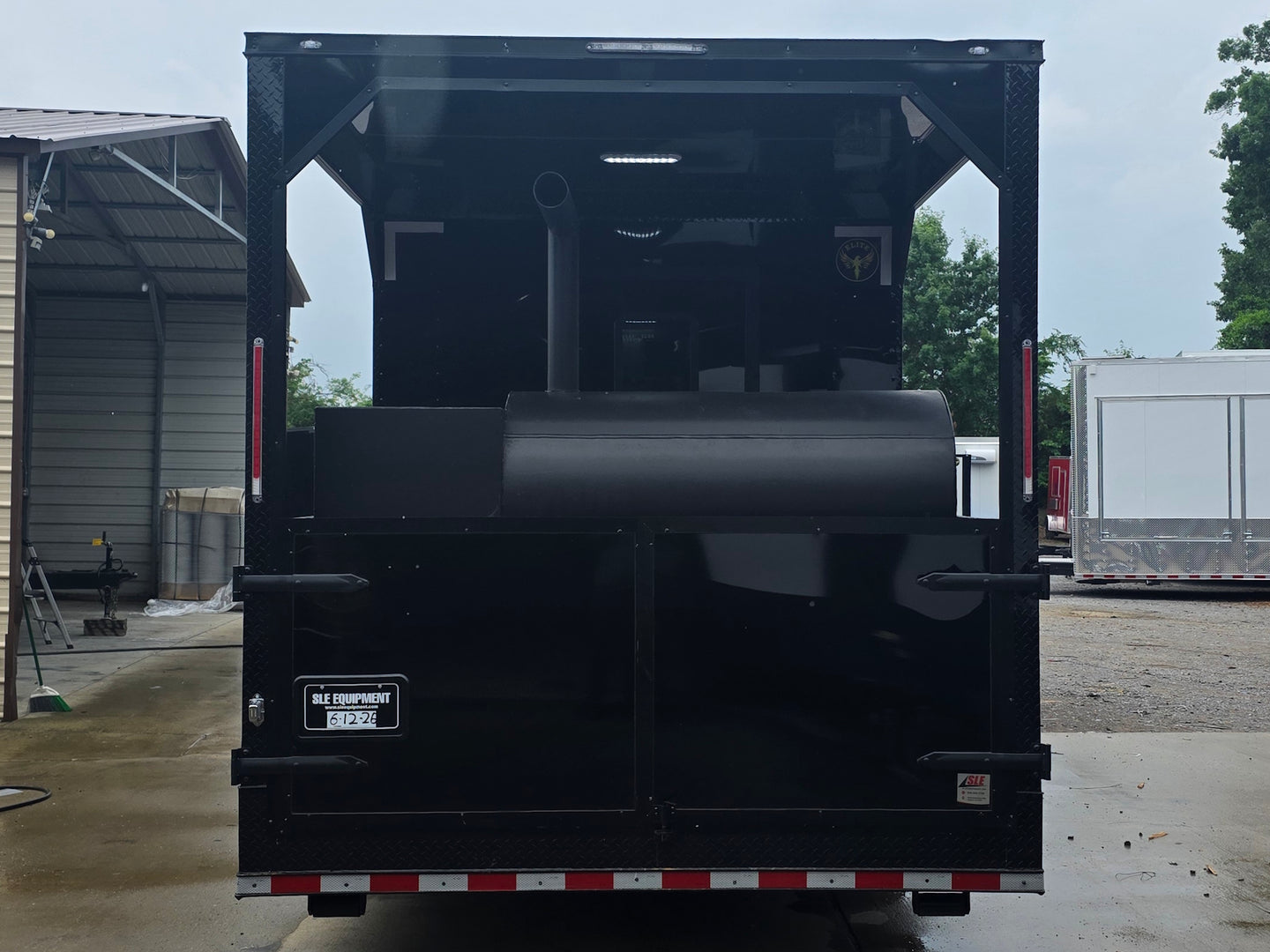 8.5'x28' Black w/ Black out trim Concession Trailer with Porch Package Back side picture 