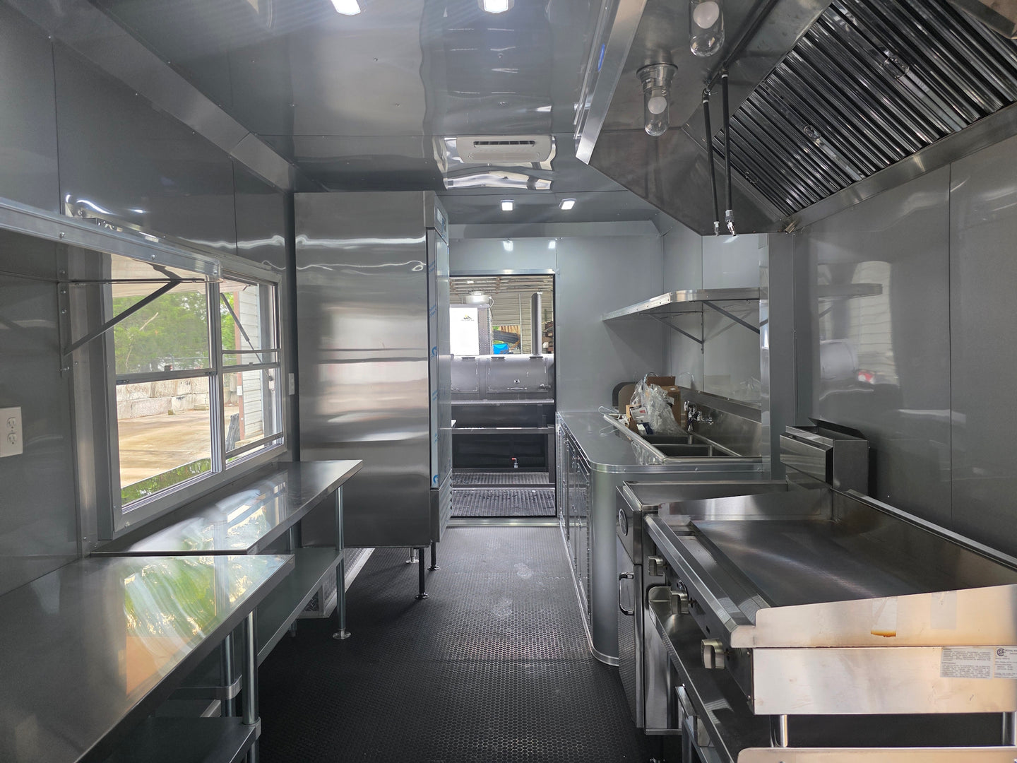8.5'x28' Black w/ Black out trim Concession Trailer with Porch Package Interior open front side picture 