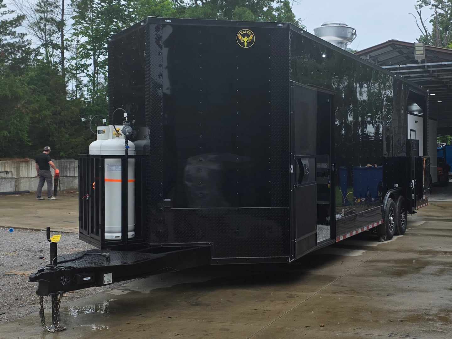 8.5'x28' Black w/ Black out trim Concession Trailer with Porch Package Open front right angle picture 