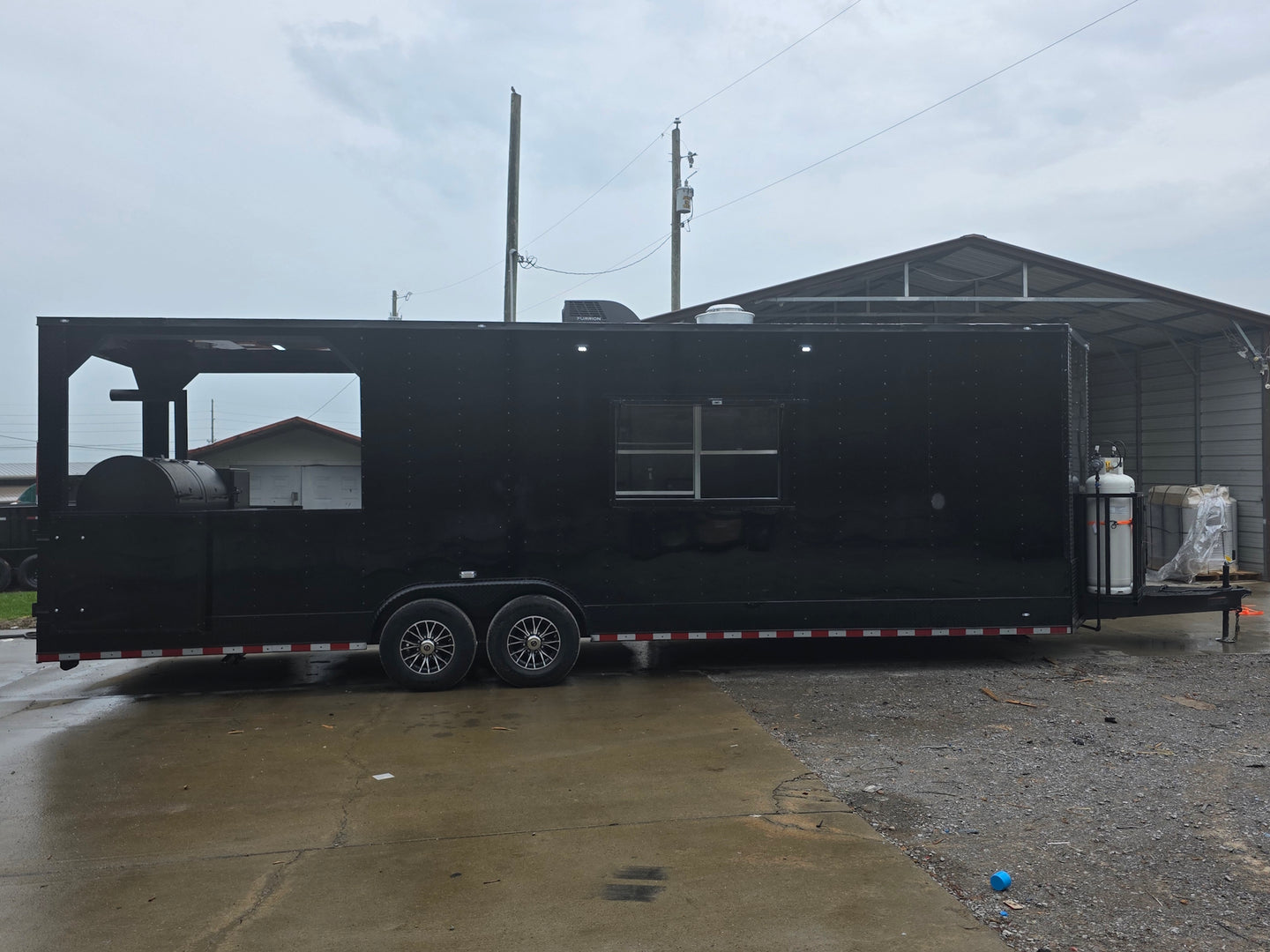 8.5'x28' Black w/ Black out trim Concession Trailer with Porch Package Open left side picture 