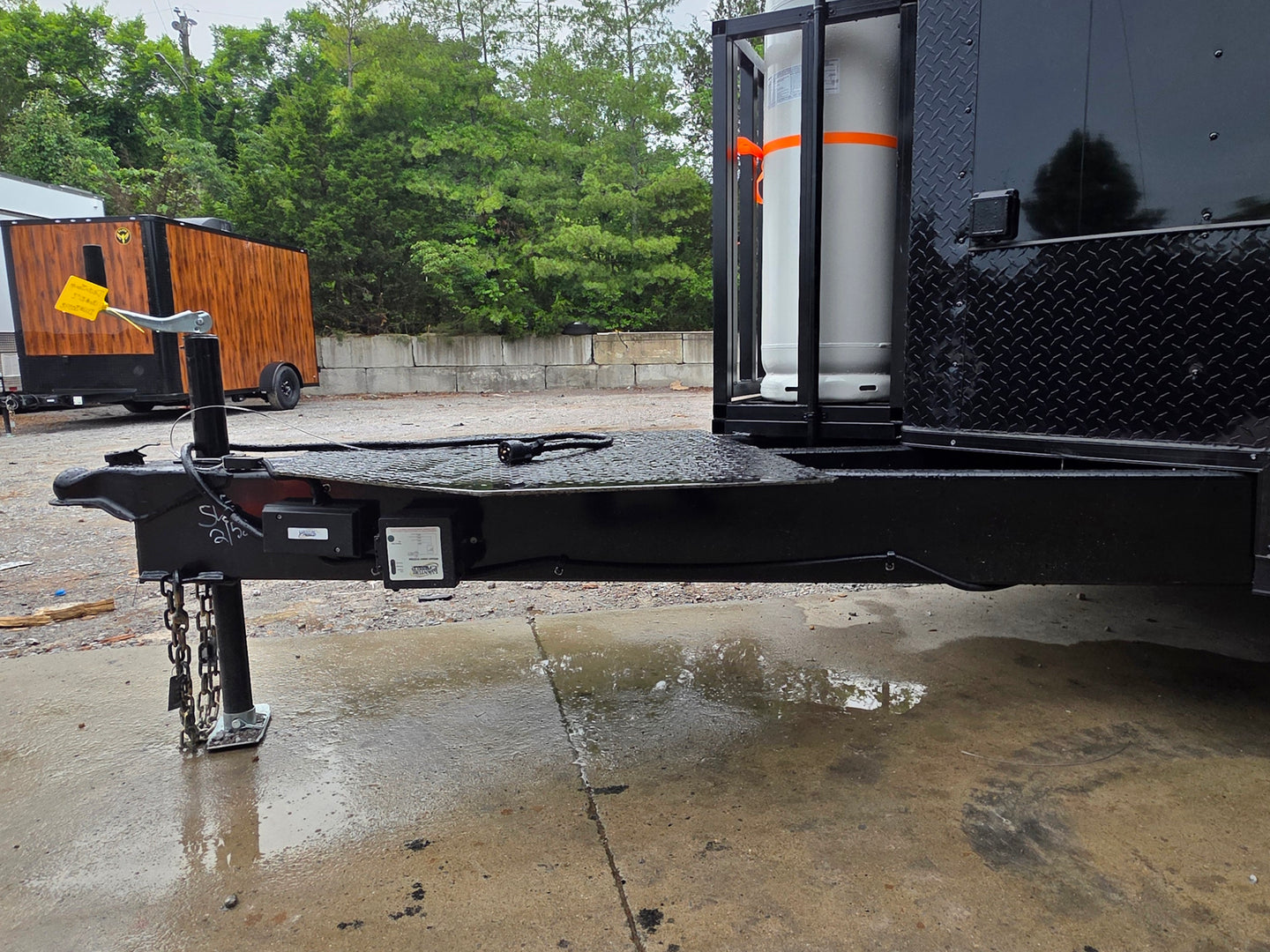 8.5'x28' Black w/ Black out trim Concession Trailer with Porch Package Tongue picture 
