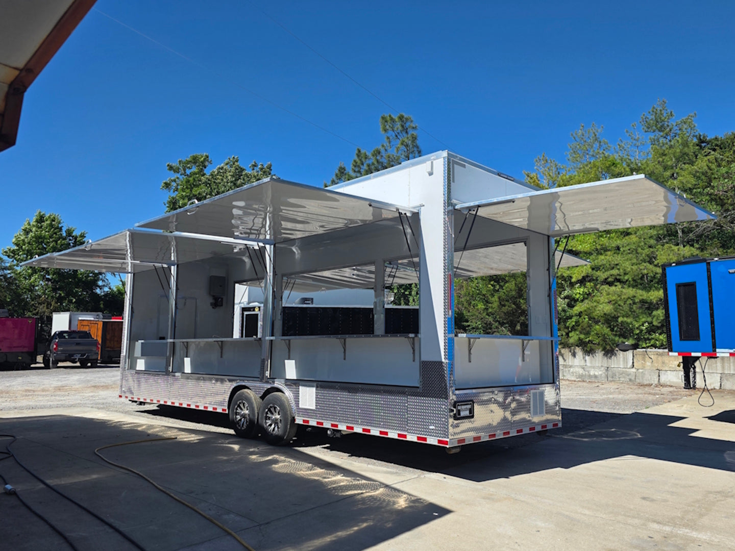 8.5' x 30' Custom Concession Trailer Package Open back left angle picture 
