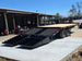 8.5x20 I Beam Deck over Dovetail Equipment Trailer 2-7k Axles with King Kong Ramps Back right-angle picture 