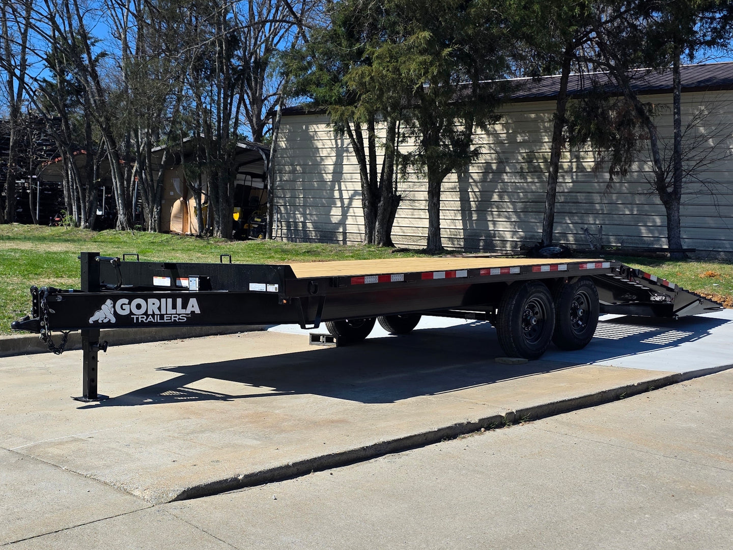 8.5x20 I Beam Deck over Dovetail Equipment Trailer 2-7k Axles with King Kong Ramps Open Front right angle picture 