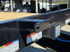 8.5x20 I Beam Deck over Dovetail Equipment Trailer 2-7k Axles with King Kong Ramps Spare tire rack view 