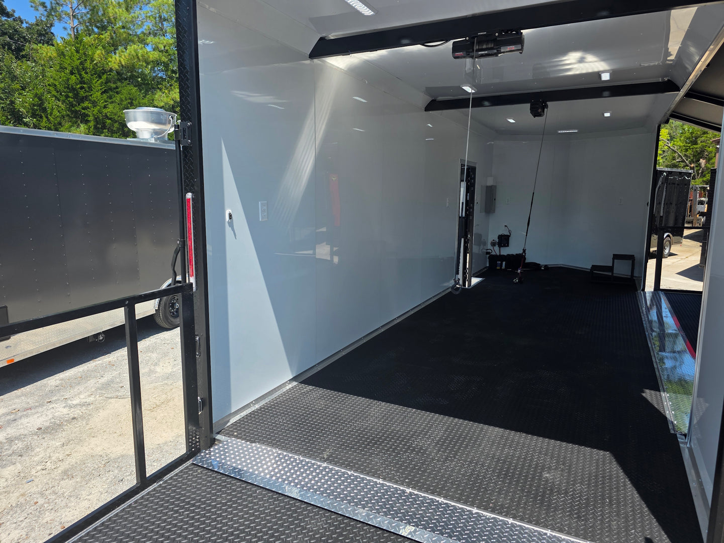 8.5x24 Black Stage trailer-34619 Back stage front right angle picture 