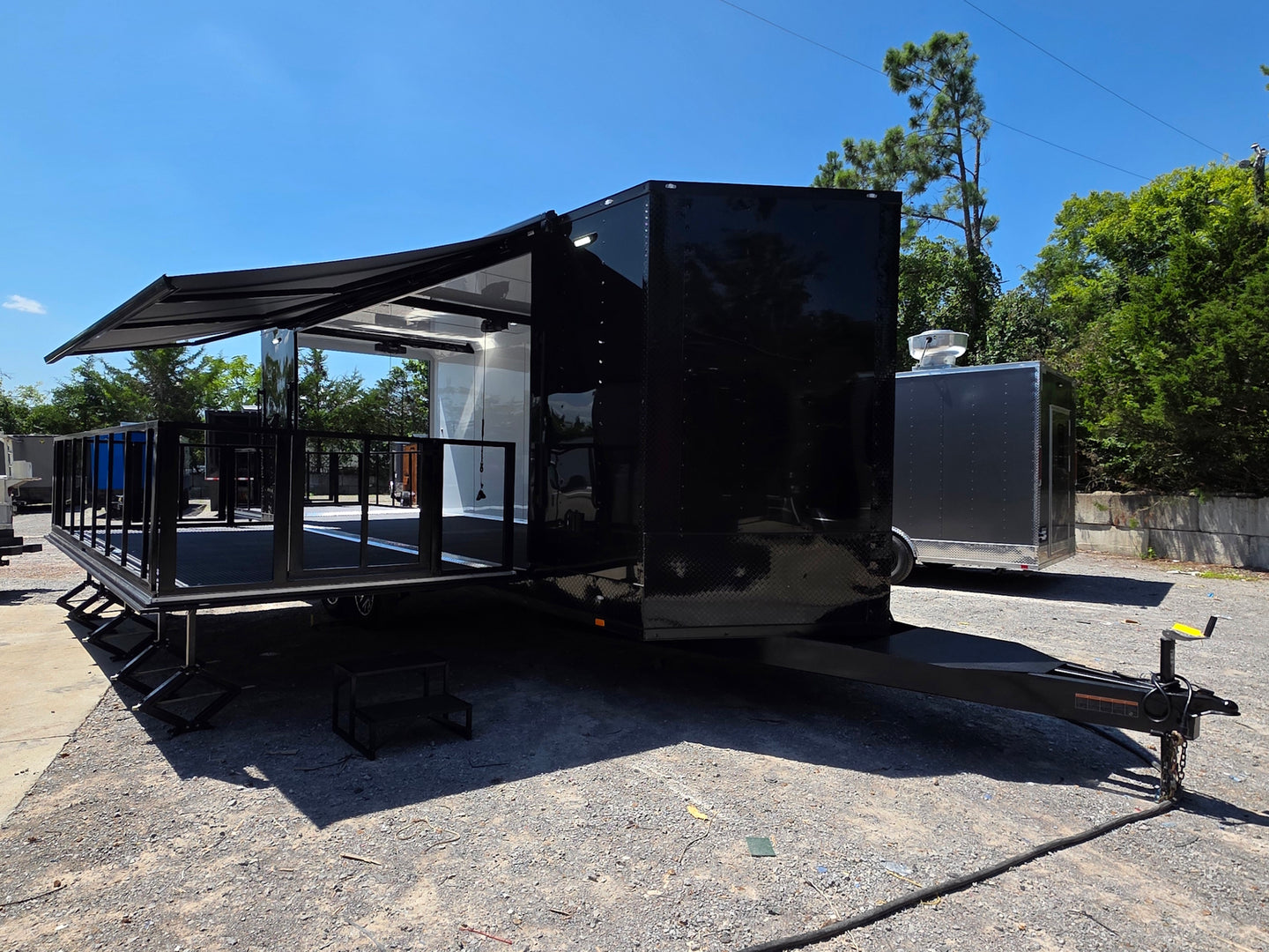 8.5x24 Black Stage trailer-34619 Open front left angel picture 