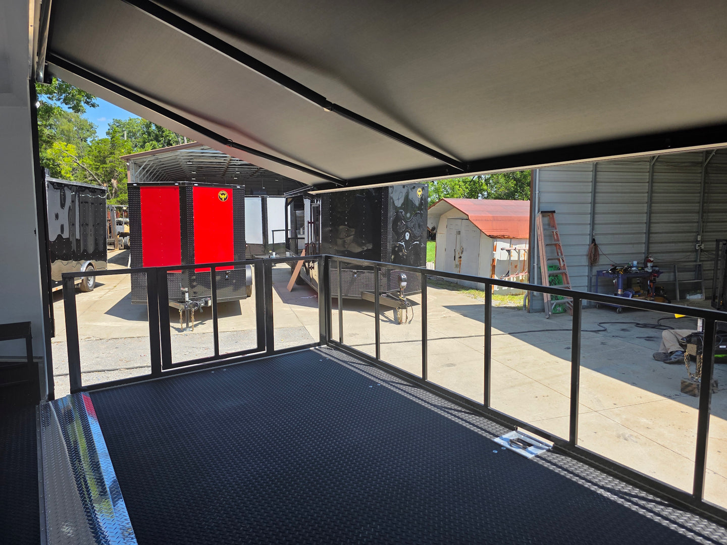  8.5x24 Black Stage trailer-34619 Side stage back left angle picture 
