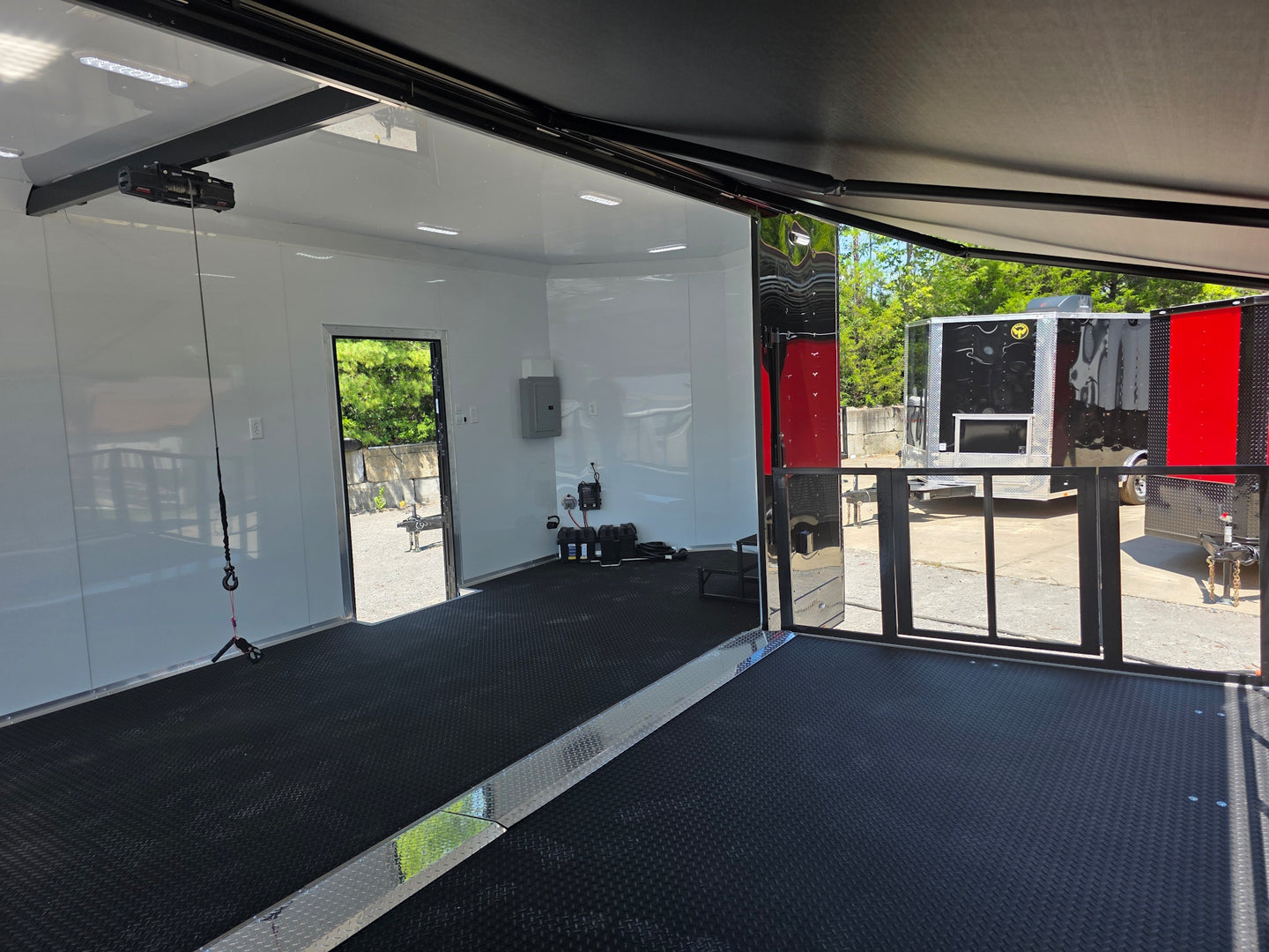 8.5x24 Black Stage trailer-34619 Side stage back right angle picture 