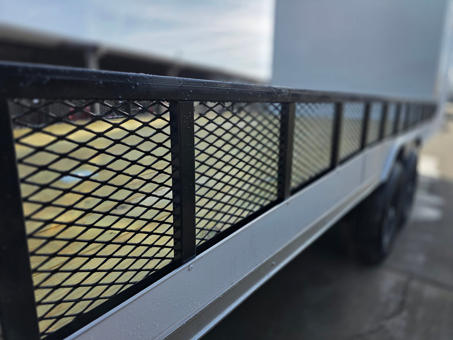 8.5x24 Hybrid White Enclosed V-Nose Trailer (2) 7000lb Axles expanded metal  angled view picture 